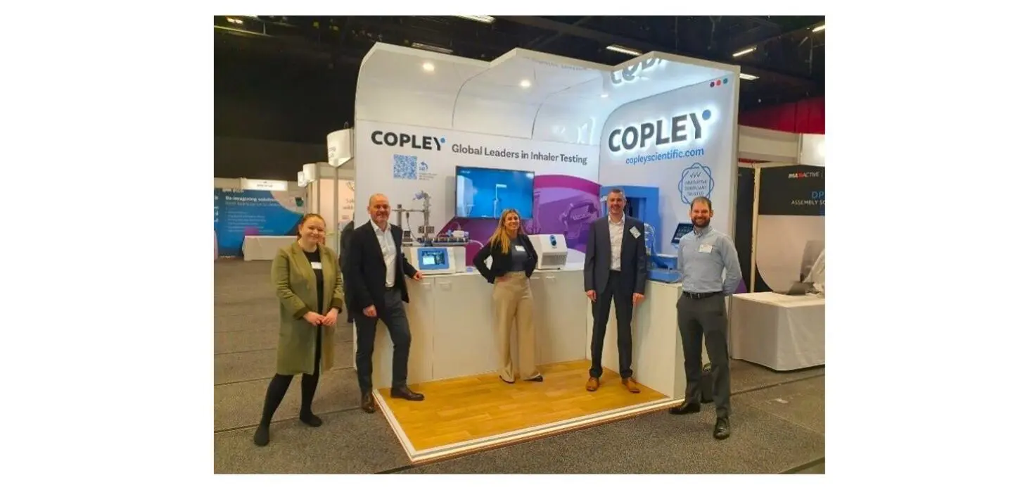 Copley team stood in front of the stand at DDL.
